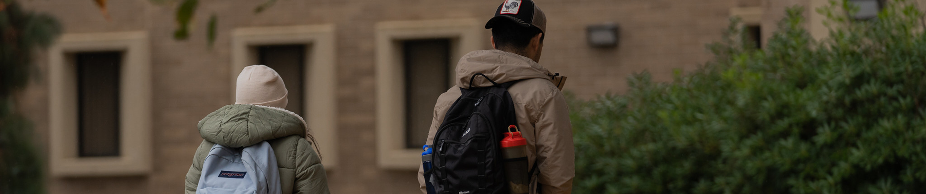 students walking outside on campus