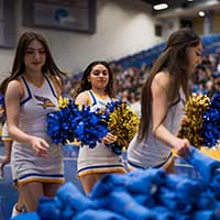 Three cheerleaders at a game