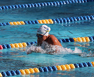 student athlete swimming in a pool